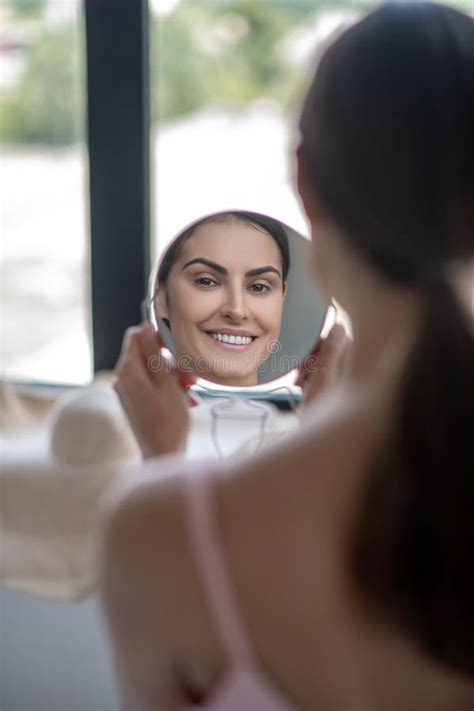 Cute Woman In Pink Lingerie Looking In The Mirror And Smiling Stock Photo Image Of Woman Pink