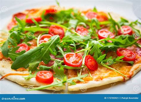 Italian Pizza With Rocket Salad Cherry Tomatoes Ham And Cheese Stock