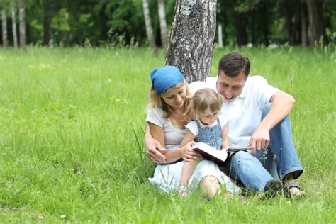 Young family reading the Bible Stock Photo by ©Kostia777 27740373