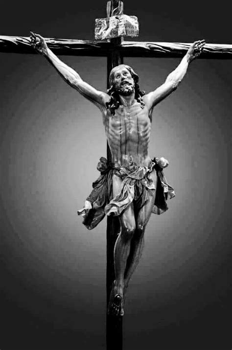 A Black And White Photo Of Jesus Crucifix With His Hands On The Cross