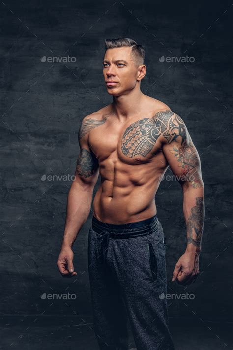 Muscular Man Fitness Model With Tattoo On His Chest Stock Photo By