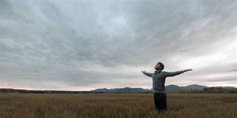 Premium Photo Man Standing On Field Against Sky