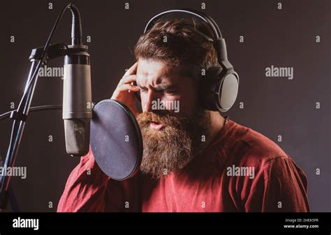 Man With Microphone Singing Song Musician In Music Hall Guy Meloman Singing In Karaoke Stock