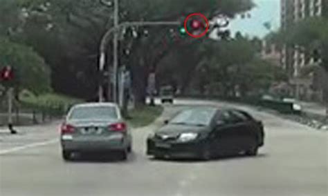 Look How Close Driver Comes To Causing Accident After Running Red Light