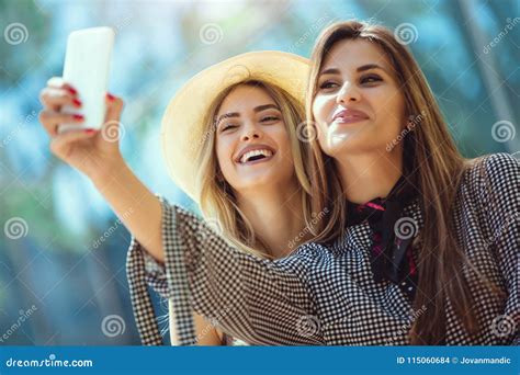 Two Female Friends Taking A Selfies Having Fun Stock Photo Image Of