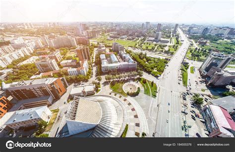 Aerial city view with roads, houses and buildings. Stock Photo by ©markin 184555376