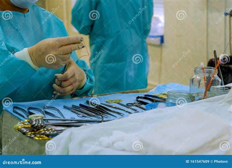 Sterilized Surgical Instruments Tools On The Blue Table Surgery