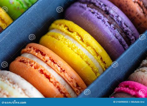 Various Colorful Macarons Or French Macaroons In A Row In A Gift Box