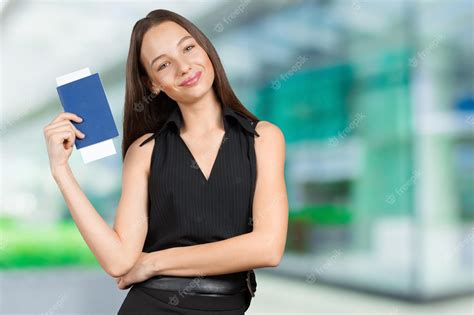 Premium Photo Portrait Of Happy Tourist Woman Holding Passport