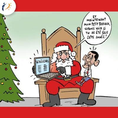 A Cartoon Santa Claus Sitting In Front Of A Laptop Computer Next To A