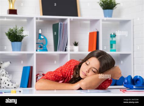 Tired And Bored Teenager School Girl Schoolgirl Is Sleeping While