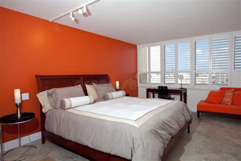 Bedroom with Burnt Orange Wall Stock Image - Image of modern, burnt ...