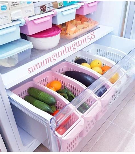 Two Bins Filled With Different Types Of Food On Top Of A Refrigerator