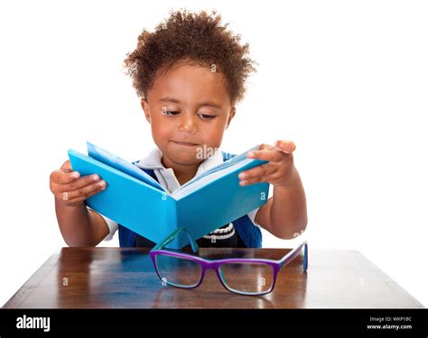 Little boy reading books, portrait of sweet African American kid ...