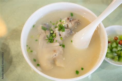 Pig feet soup, a traditional Sichuan cuisine in China. Stock Photo | Adobe Stock