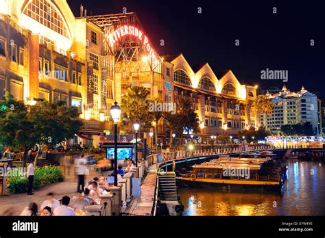 SINGAPORE - APR 5: Clarke Quay at night with street view and restaurant ...