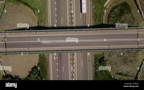 Top down view of highway intersection car bridge and moving cars Stock ...