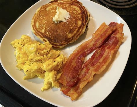 Scrambled Eggs And Bacon And Pancakes