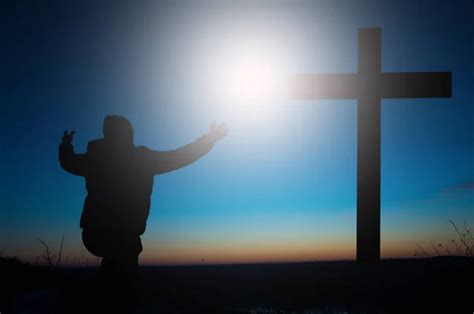 Cross Of Jesus Man Kneeling Worshiping God In Prayer Stock Image