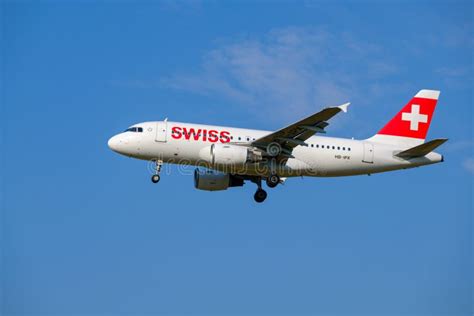 Swiss Airlines Airplane Preparing For Landing At Day Time In