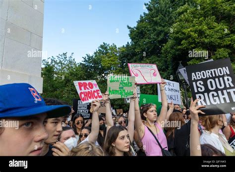 The Protesters Holding Cardboard Signs After Supreme Court Overturned