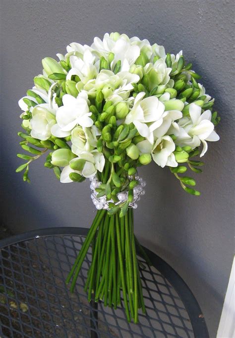 White freesia bouquet | White wedding bouquets, Freesia bouquet ...