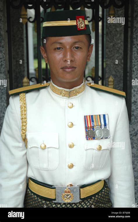 A Malaysian army officer on guard duty outside the National Palace in ...