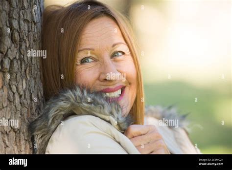 Portrait Attractive Beautiful Mature Woman Sitting Happy Relaxed With Friendly Smile Outdoors