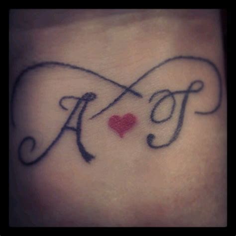 My 2nd Tattoo Mine And Tjs Initials With A Heart And Infinity Symbol On The Inside Of My Wrist