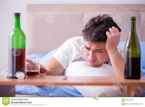 The Man Alcoholic Drinking In Bed Going Through Break Up Depression