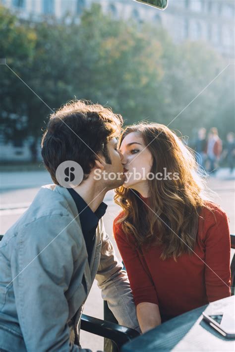 Loving Couple Sharing A Kiss Outdoors In Beautiful Backlight Love