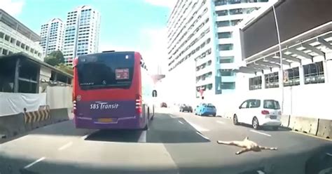 Naked Man Lies Flat In The Middle Of A Busy Road Driver Used His Car To Protect Man From