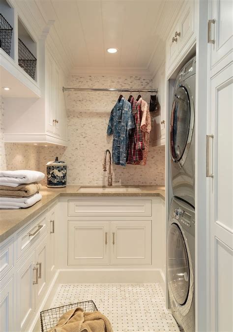 A Washer And Dryer In A White Laundry Room