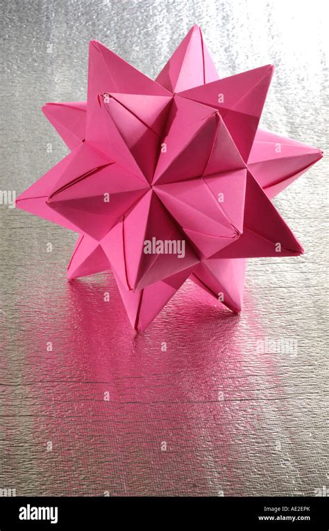 Origami abstract paper figure polyhedron Stock Photo - Alamy