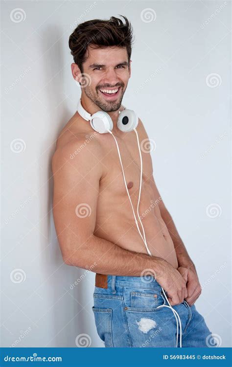 Handsome Young Man Listening Music On Headphones Stock Image Image Of Isolated Casual 56983445