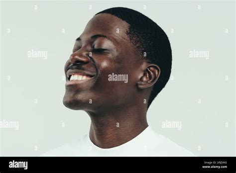 Happy Young Man Celebrating His Beautiful And Glowing Melanin Skin With