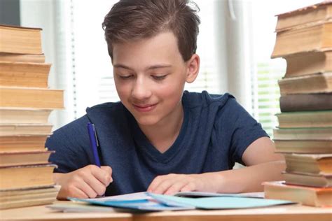 Boy Studing Table Blue Background Many Book Stock Photo By ©chepko