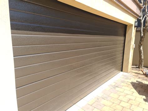 Double Bronze Slatted Aluzinc Garage Door Nu Ray Doors