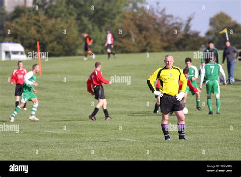 Shot Of Amateur Footballers Playing In The Downs League On A Saturday