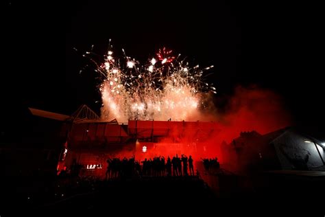 Liverpool fans let off fireworks outside Anfield to celebrate Premier ...