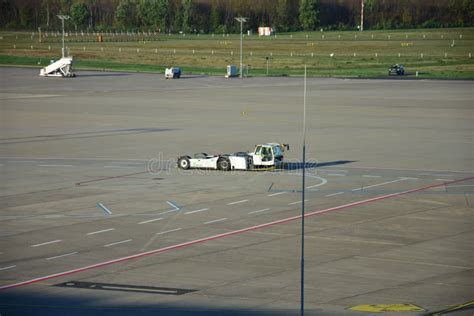 Aircraft Tug On An Airport With Ground Marker Editorial Photography