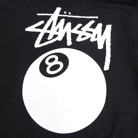 The Back Of A Black Shirt With White Lettering And A Eight Ball On It S