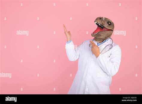 Funny T Rex Head Doctor Concept On Pink Isolated Background Stock Photo
