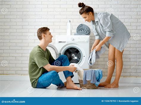 Loving Couple Is Doing Laundry Stock Image Image Of Caucasian Holding 153678793