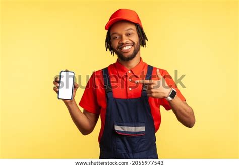 Portrait Happy Handyman Wearing Uniform Pointing Stock Photo 2055977543