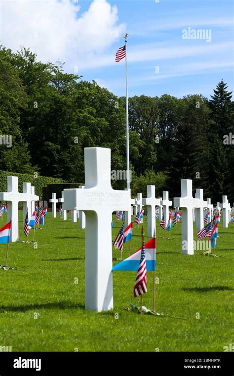 American flag on a flag pole in the Luxembourg American Cemetery and ...