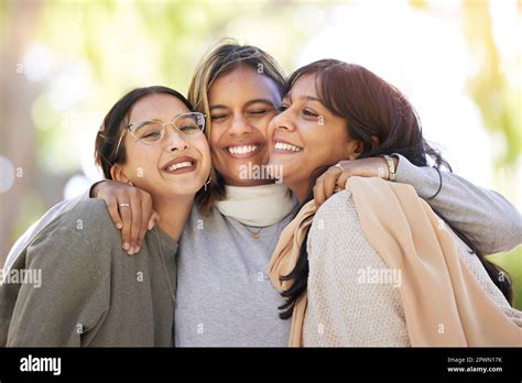 Women Friends Hug And Smile In Park For Happiness Support And Relax