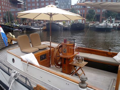 10 Stunning Houseboats Airbnbs On Amsterdam Canals - ItsAllBee | Solo Travel & Adventure Tips