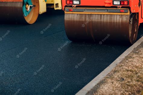 Premium Photo Asphalt Paving Paver Road Rollers New Road Construction