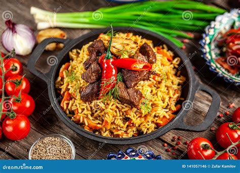 The Concept Of Oriental Cuisine National Uzbek Pilaf With Meat In A